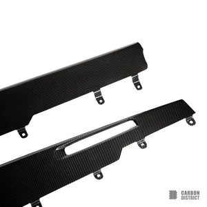 BMW X6M (F96) carbon fibre side skirts — UV-stable gloss finish detail