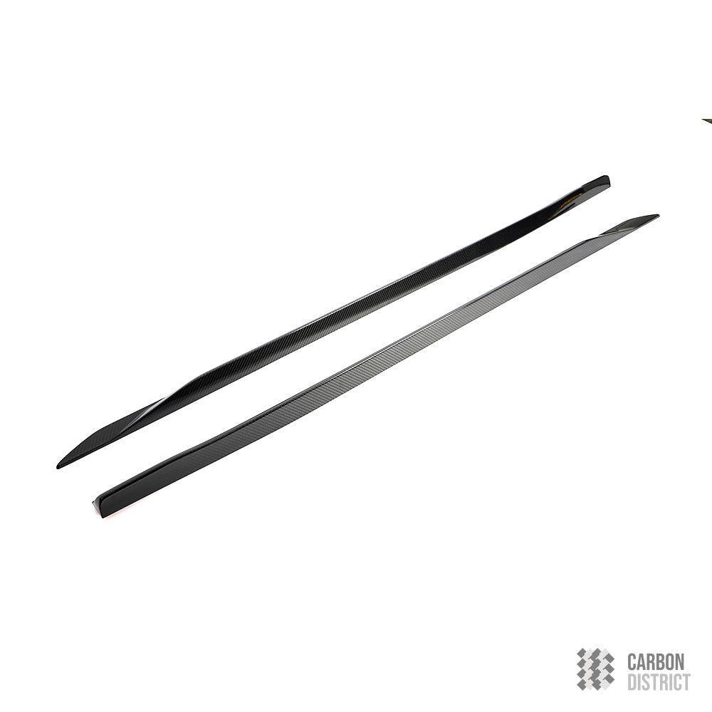 BMW 5 Series / i5 (G60) carbon fibre side skirt extensions — UV-stable gloss finish detail