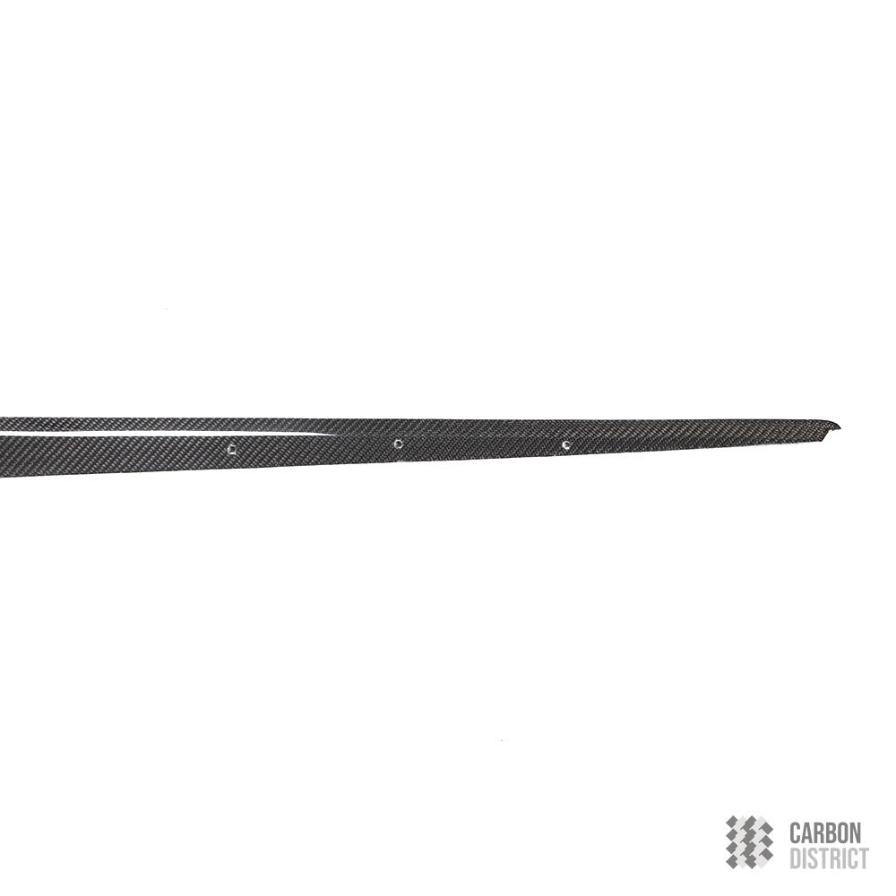 BMW 1 Series (F20) carbon fibre side skirts — UV-stable gloss finish detail