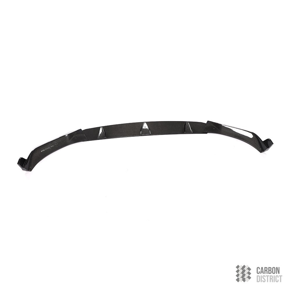 BMW X7 M Sport (G07) carbon fibre front lip — UV-stable gloss finish detail