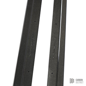 BMW 5 Series (F10) carbon fibre side skirts — UV-stable gloss finish detail