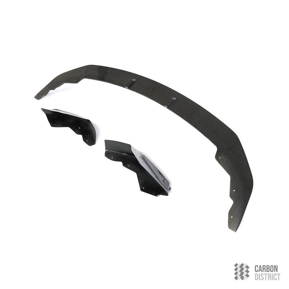 BMW 1 Series (F20) carbon fibre front lip — UV-stable gloss finish detail