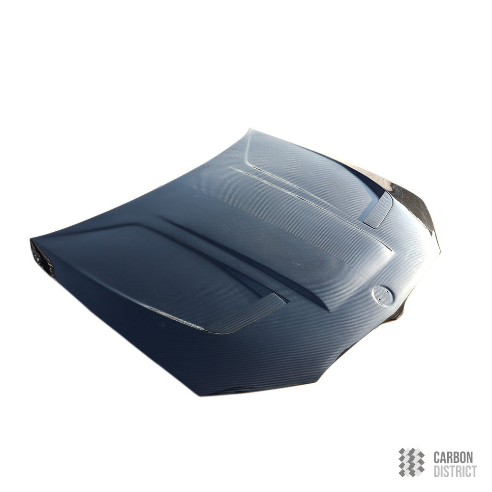 BMW M5 (F90) prepreg dry carbon fibre bonnet — dry carbon weave