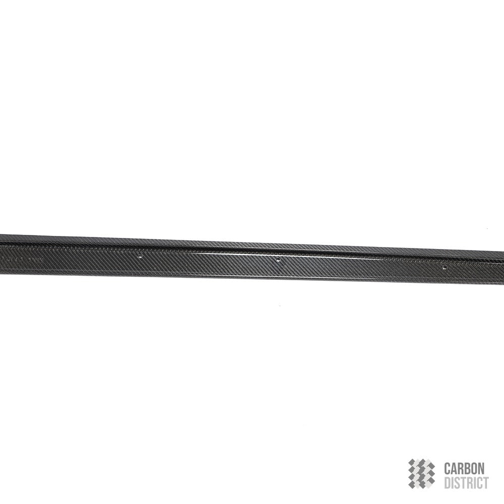 Toyota Supra (A90) carbon fibre side skirts — UV-stable gloss finish detail