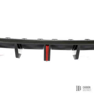 VW Golf Mk8 carbon fibre rear diffuser — UV-stable gloss finish detail