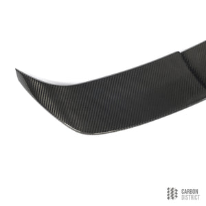 BMW M5 (G99) dry carbon fibre spoiler — UV-stable gloss finish detail
