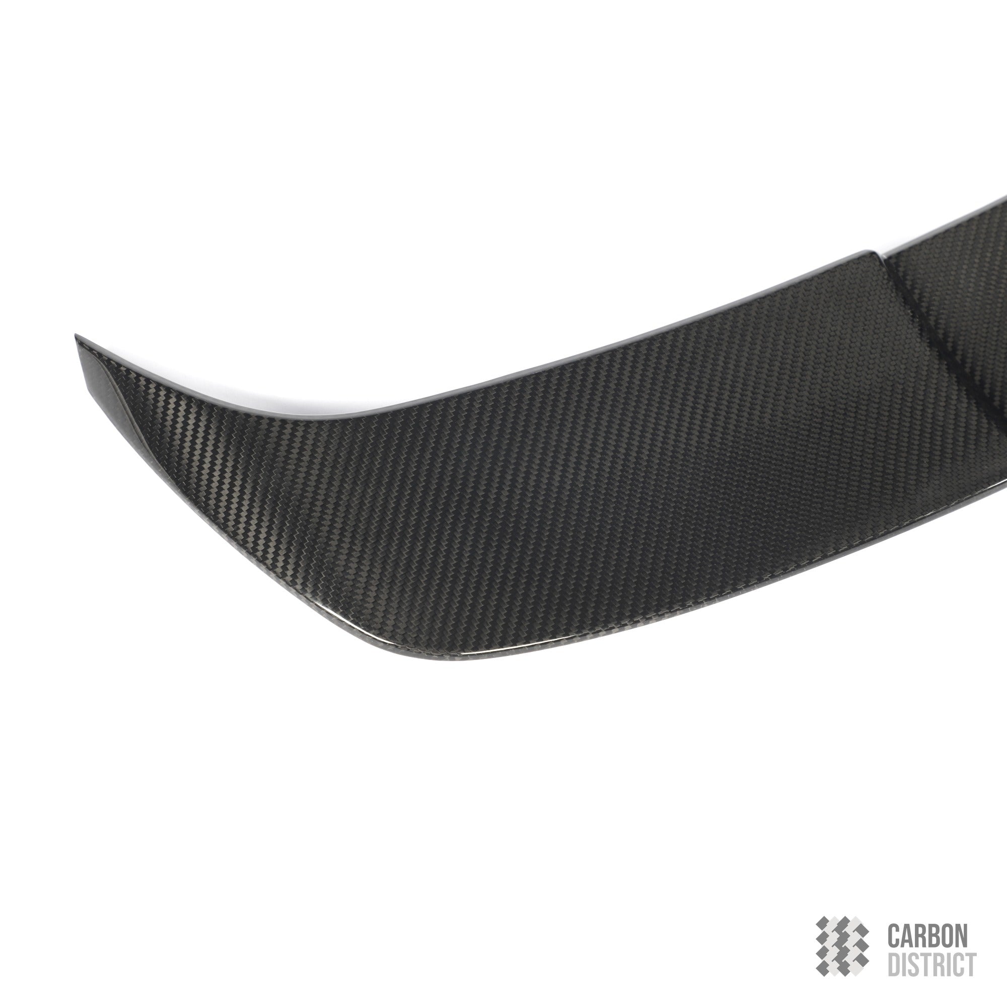 BMW M5 (G99) dry carbon fibre spoiler — UV-stable gloss finish detail