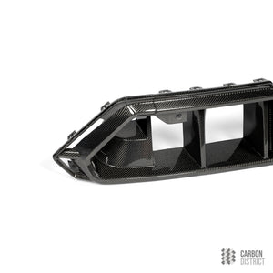 BMW M5 (G90/G99) carbon fibre front bumper insert — full product view