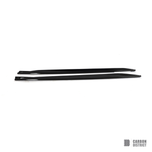 BMW i4 (G26) carbon fibre side skirts — 3K twill gloss finish