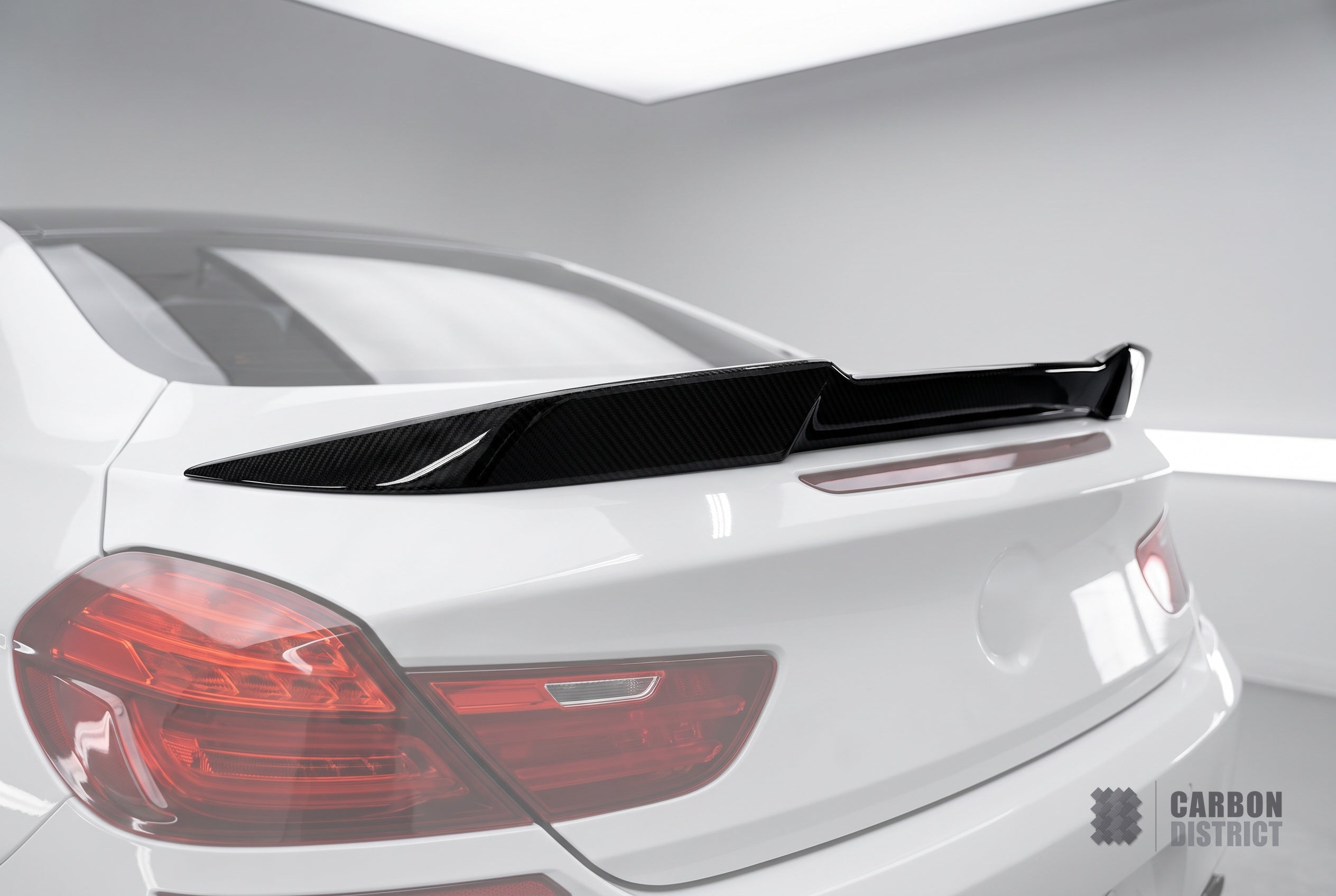 BMW 6 Series (F06/F12) carbon fibre spoiler (Ducktail) — UV-stable gloss finish detail