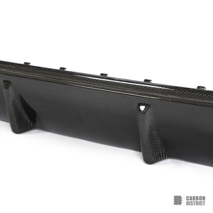 BMW i4 (G26) carbon fibre rear diffuser — UV-stable gloss finish detail