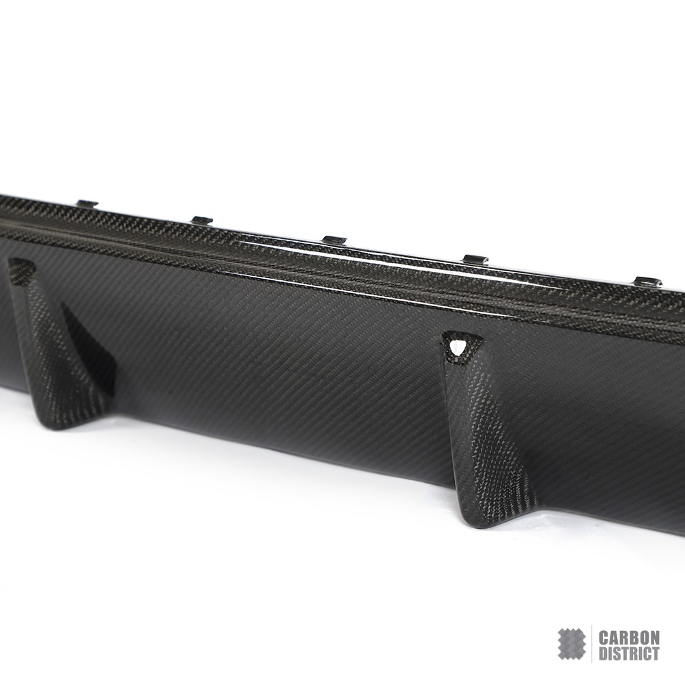 BMW i4 (G26) carbon fibre rear diffuser — UV-stable gloss finish detail