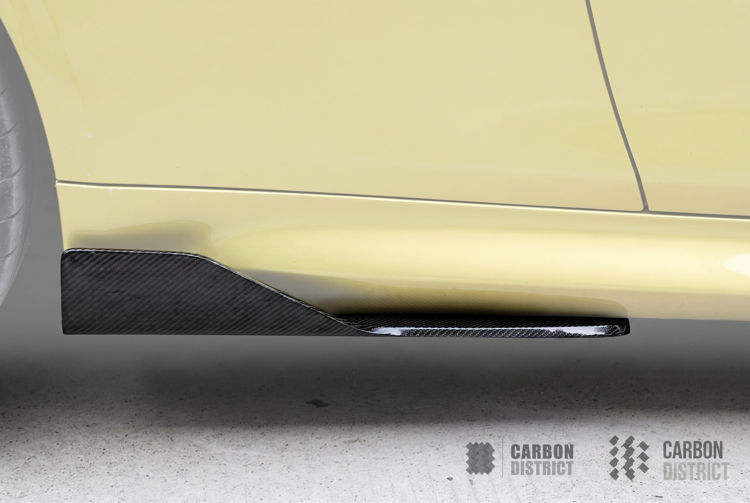 BMW M3/M4 (F8x) carbon fibre side skirt extensions — UV-stable gloss finish detail