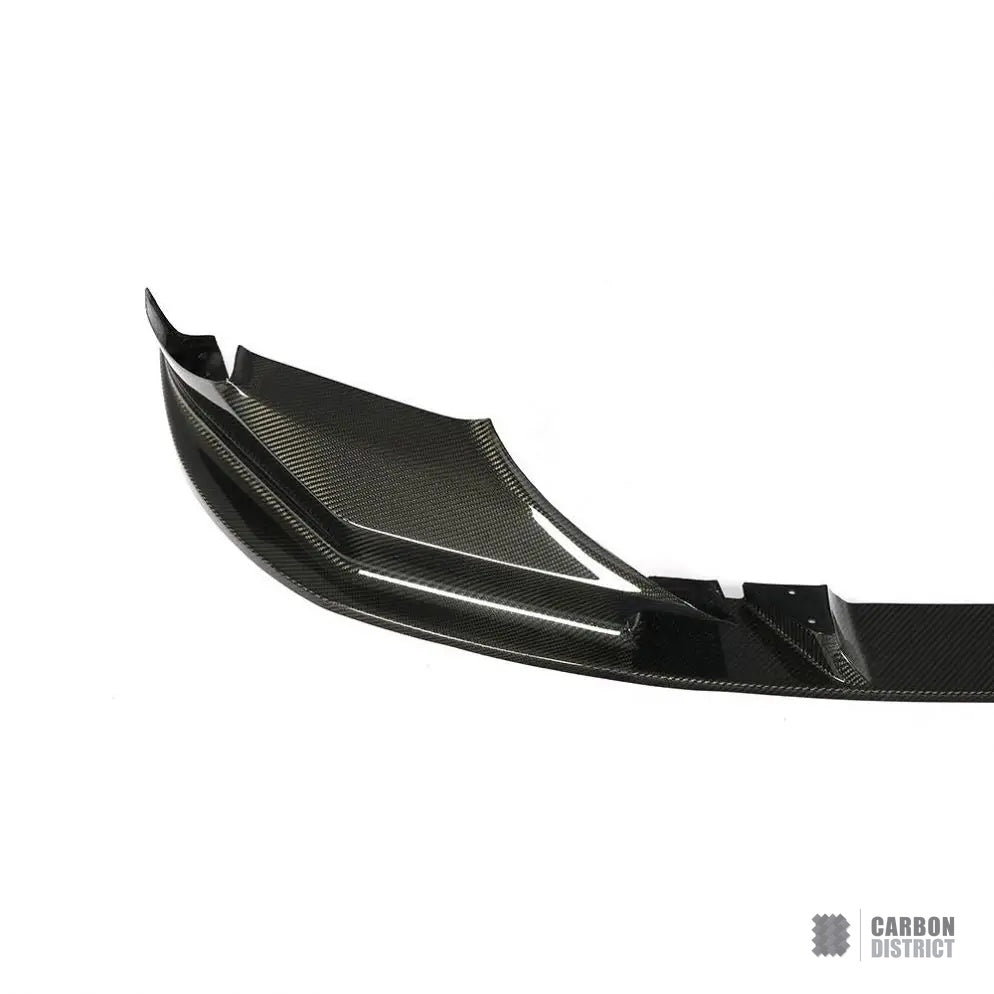 BMW M5 (F90) carbon fibre front lip (V1) — UV-stable gloss finish