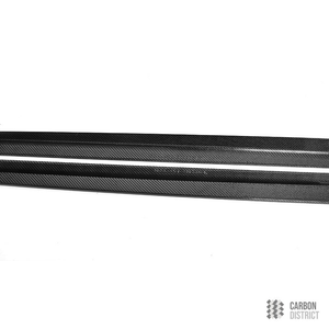 BMW M5 (F90) carbon fibre side skirts — 3K twill gloss finish