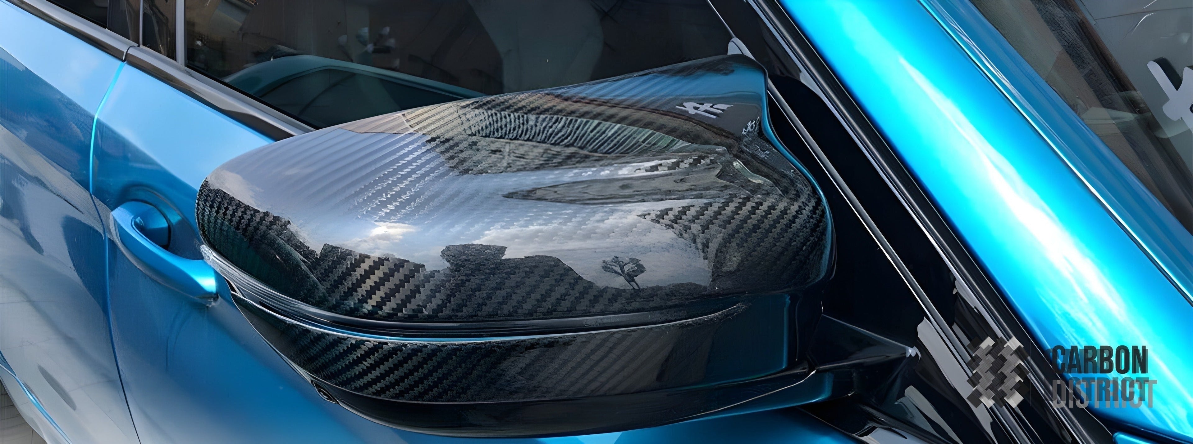 BMW M5 (F90) dry carbon fibre mirror caps — UV-stable gloss finish detail