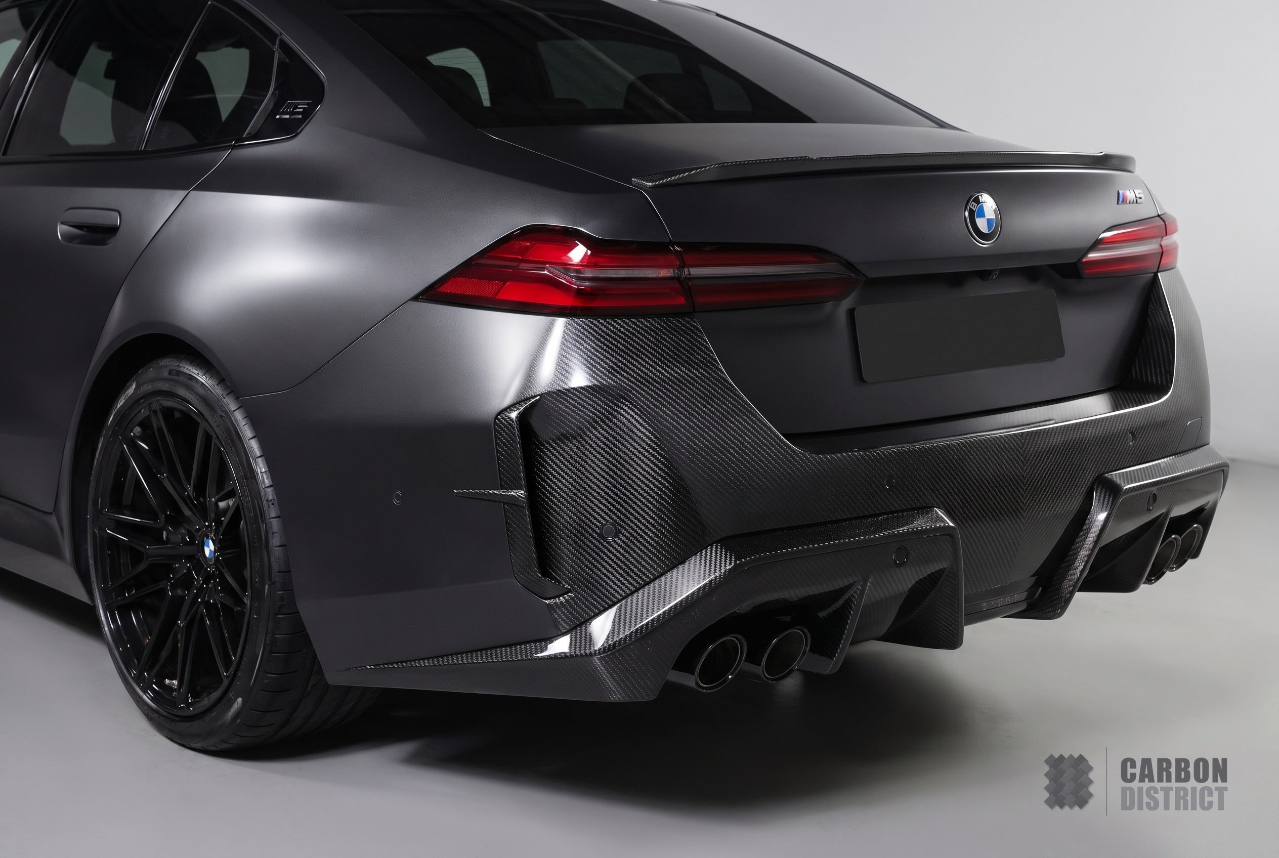 BMW M5 (G90/G99) carbon fibre rear canards — 3K twill gloss finish