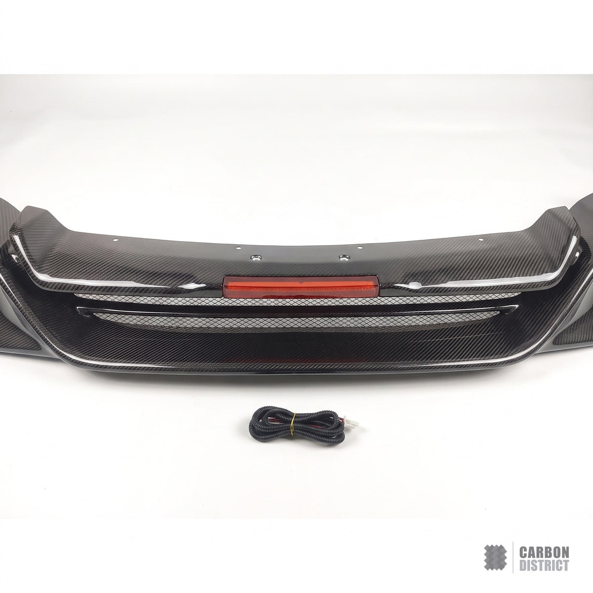 Nissan GT-R R35 TS style carbon fibre rear diffuser lip, white studio product shot