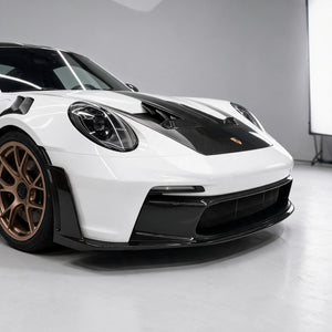 Dry carbon front lip, canards and vented bonnet on a white Porsche 911 GT3 RS (992)