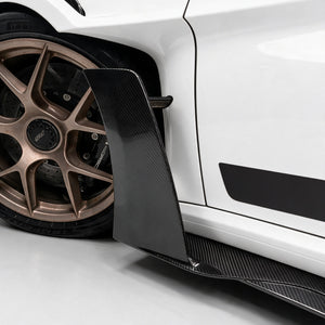 Dry carbon front knife wing standing proud of the sill on a Porsche 911 GT3 RS (992)