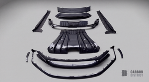 Porsche 911 GT3 (992) carbon fibre body kit — full parts laid out, dry carbon