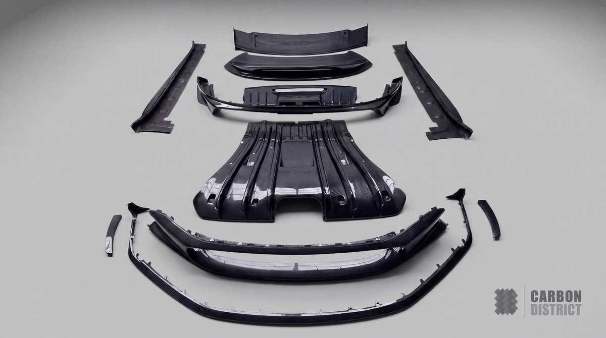 Porsche 911 GT3 (992) carbon fibre body kit — full parts laid out, dry carbon