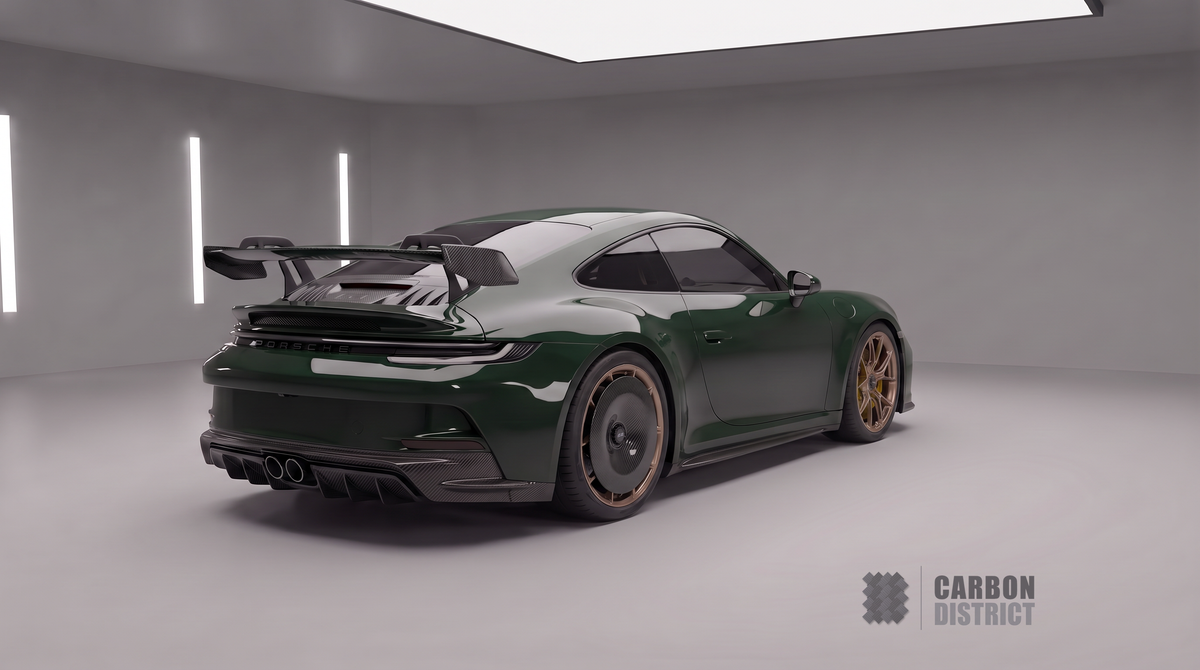 Porsche 911 GT3 (992) in Racing Green with Carbon District carbon fibre body kit — rear three-quarter