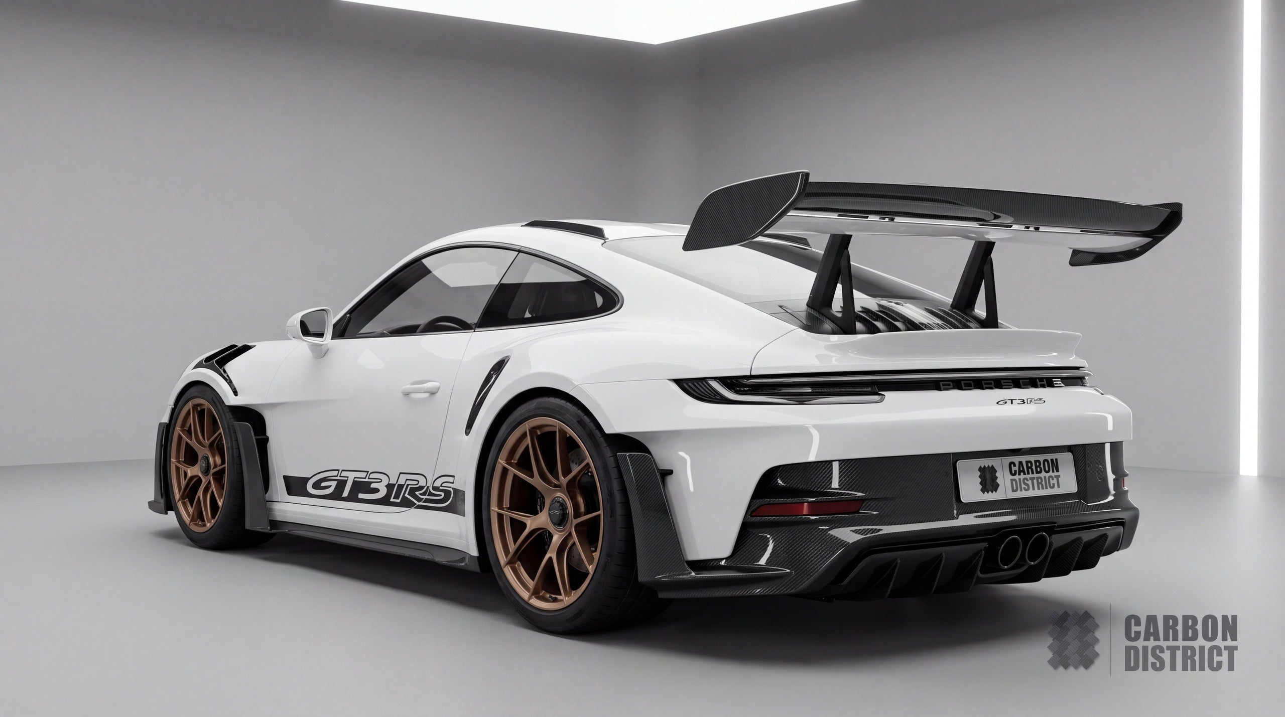 Porsche 911 GT3 RS (992) dry carbon fibre body kit, rear three-quarter view showing wing end plates, rear bumper lower section and diffuser
