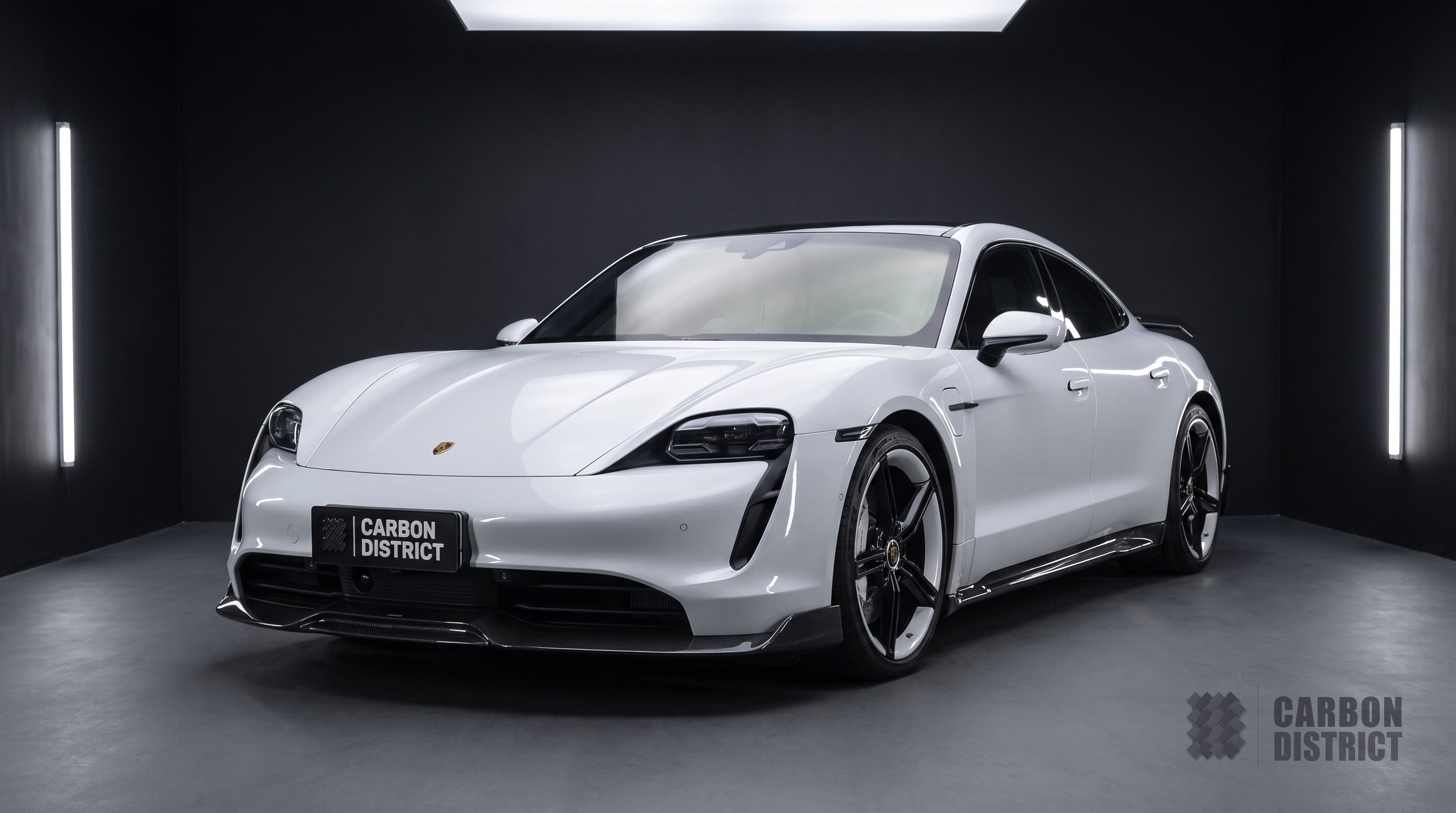 Porsche Taycan carbon fibre body kit with ducktail spoiler, front three-quarter