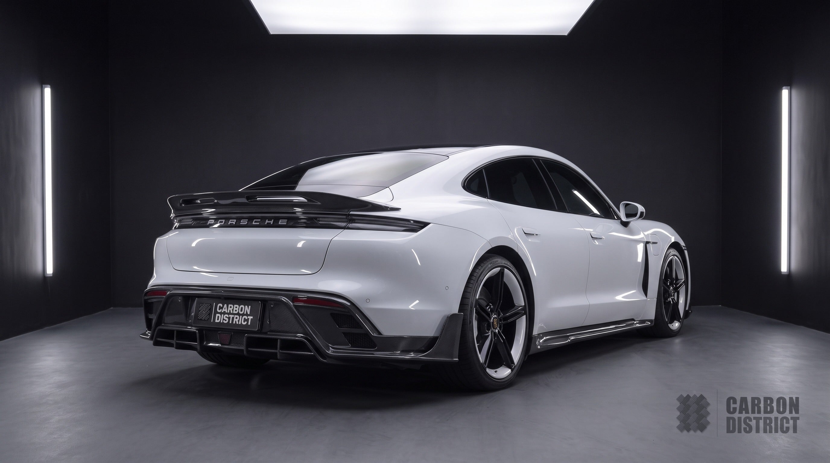 Porsche Taycan carbon fibre body kit with ducktail spoiler, rear three-quarter